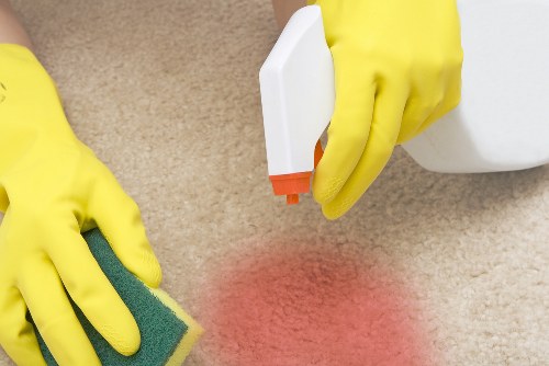 Professional cleaners in Putney servicing a modern home interior